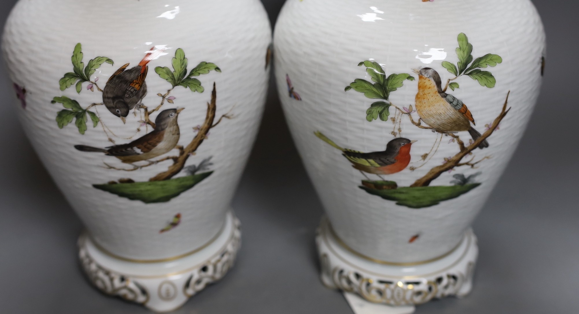 A pair of Herend Rothschild Birds pattern lamps, lacking fittings and wiring, 32cm tall